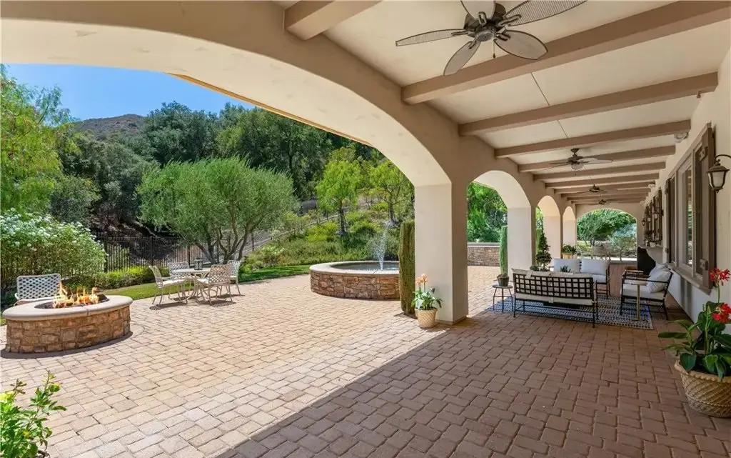 Covered terrace and yard photographed by Vuepoint Visuals