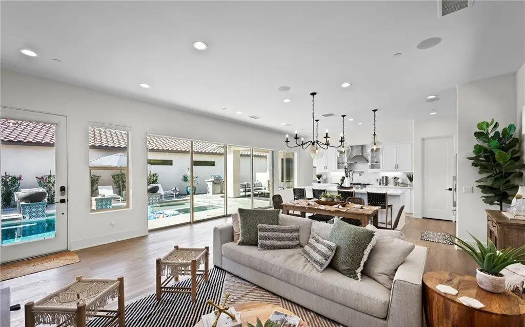 Living room with a pool view photographed by Vuepoint Visuals