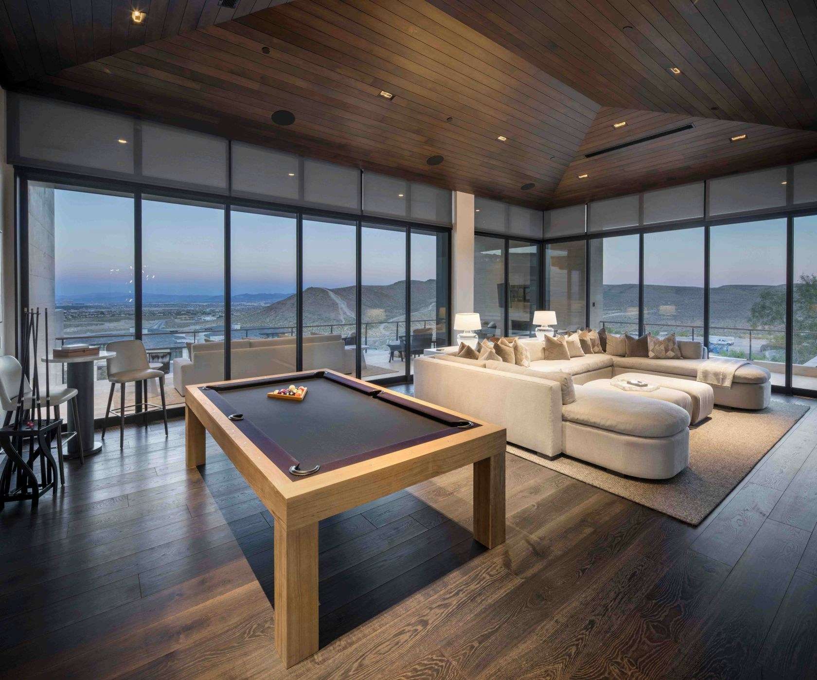 Entertainment suite with billiards table and panoramic views